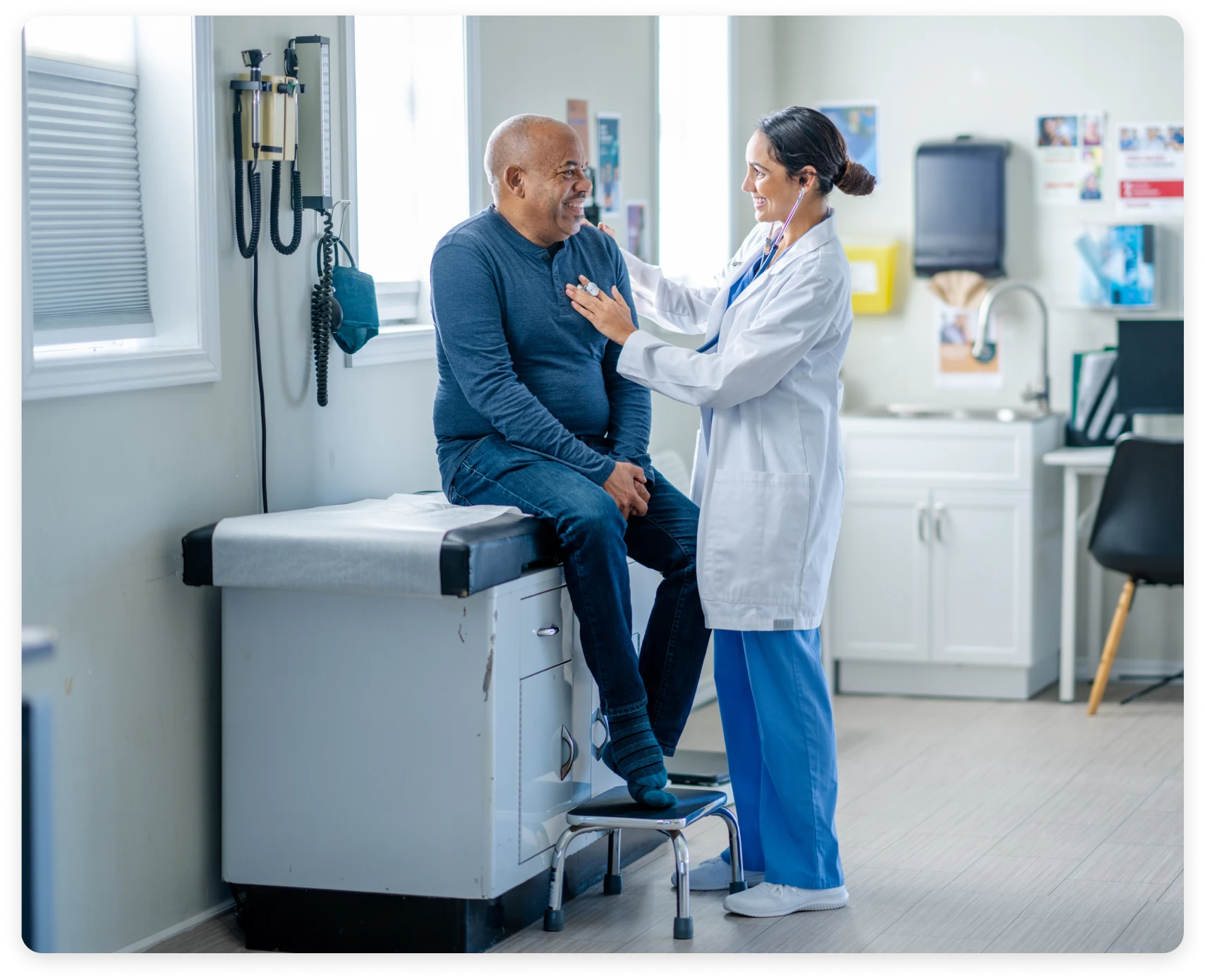 Doctor consulting with patient in examination room