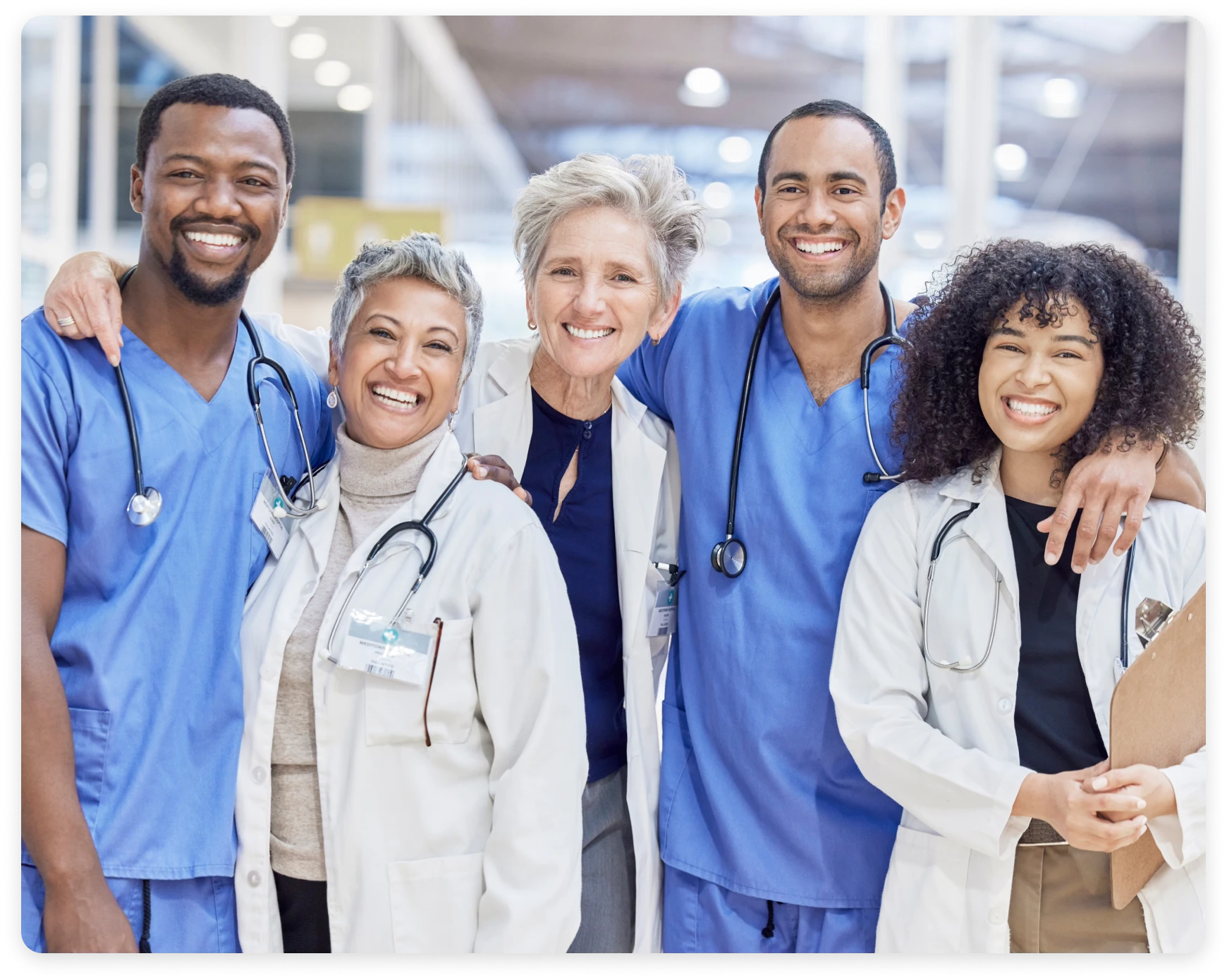 Diverse healthcare professionals posing together