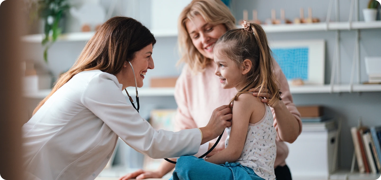 Pediatrician visit with child and mother