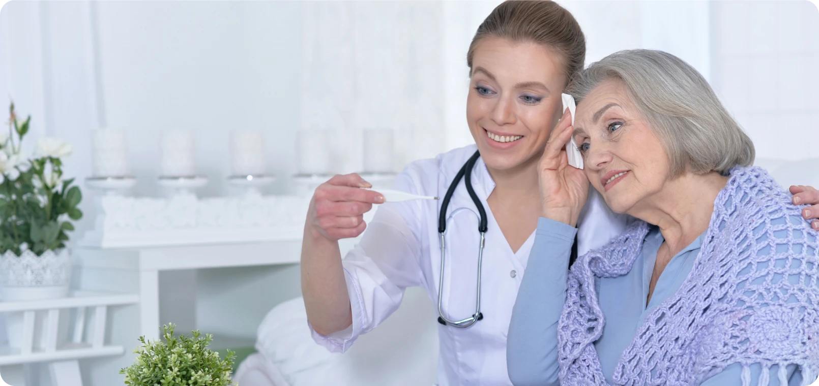 Nurse smiling with senior patient